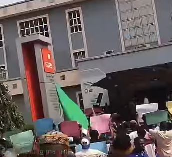 Release VeryDarkMan now, protesters chant at GTBank Headquarters Abuja